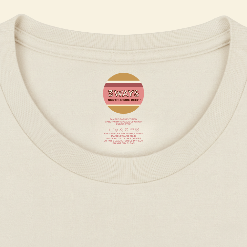 Neck view of the ivory tee showing sample custom printed label