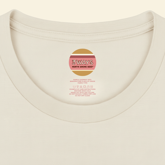 Neck view of the ivory tee showing sample custom printed label