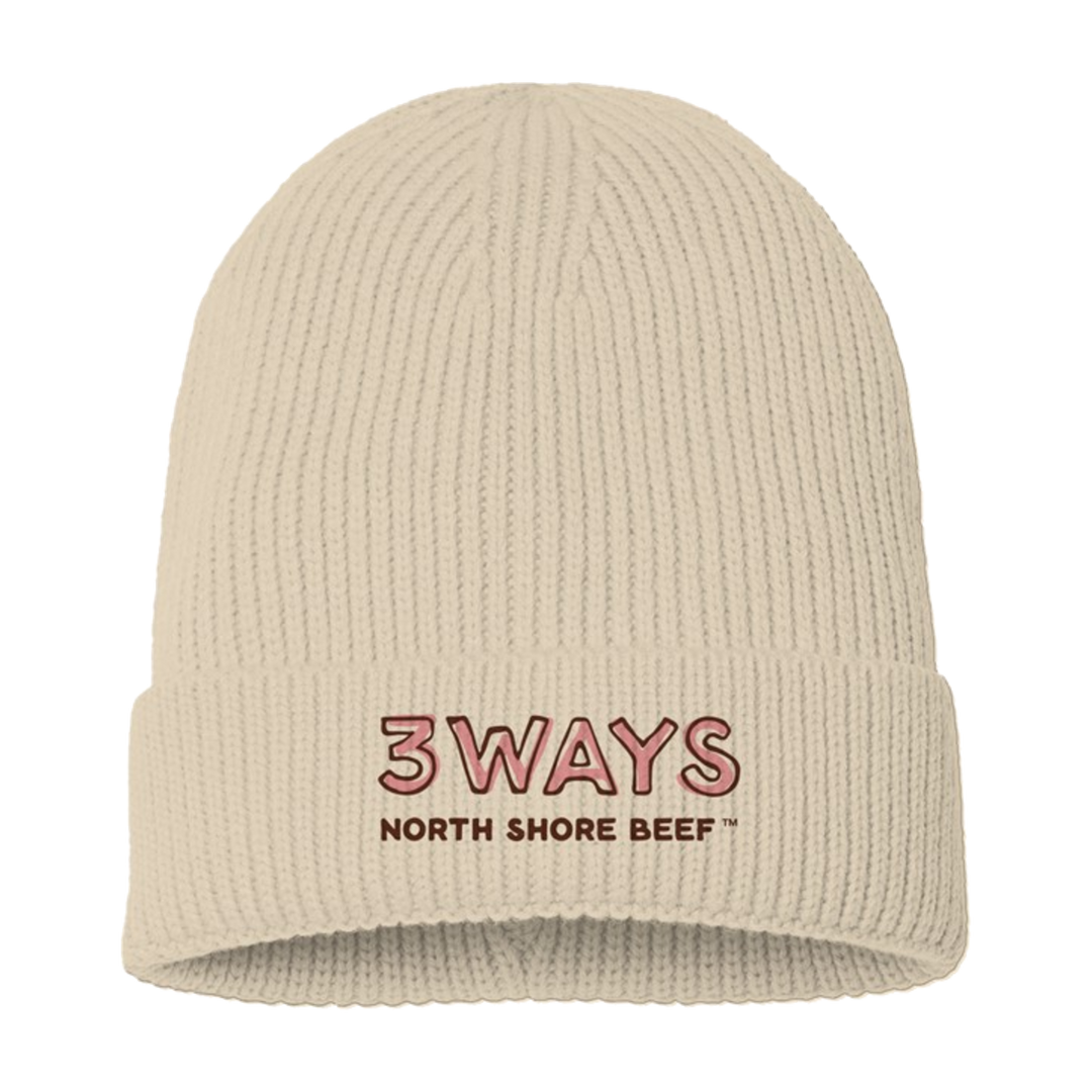 Layers, an ivory knit beanie with a coral and brown embroidered horizontal 3WAYS North Shore Beef™ logo